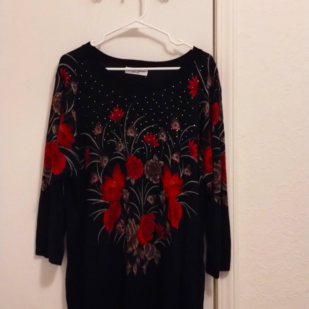 Black sweater with red and tan floral print